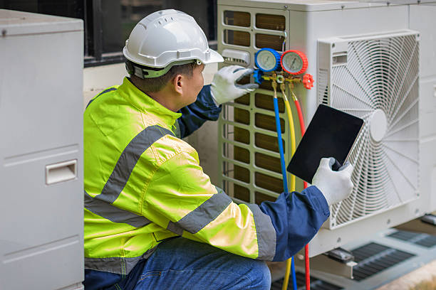 Professional Heat Pump Repair technician working in Wingo, KY